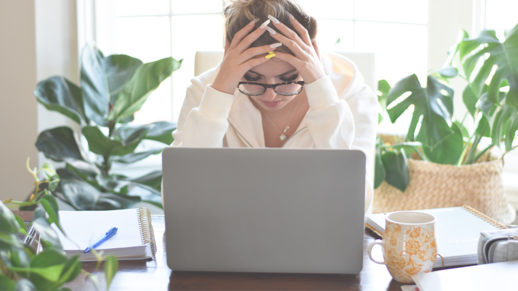 Woman at Desk Overwhelmed